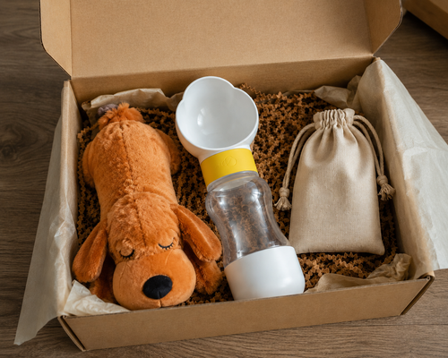 Cuki Comfort Bundle with portable water bottle, dog plush toy and cotton bag presented in a gift box.